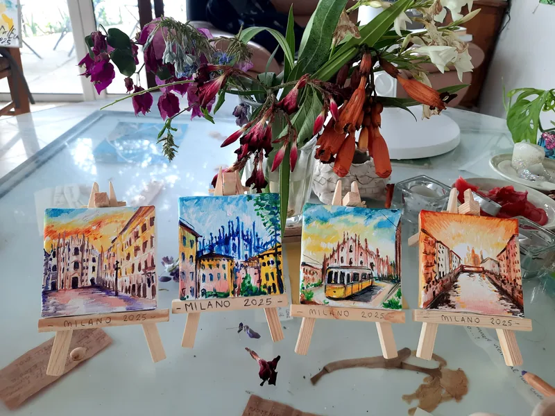 Example of a hand-painted client gift: Giulia Dal Bon painted four small views of Milan, set on miniature easels.