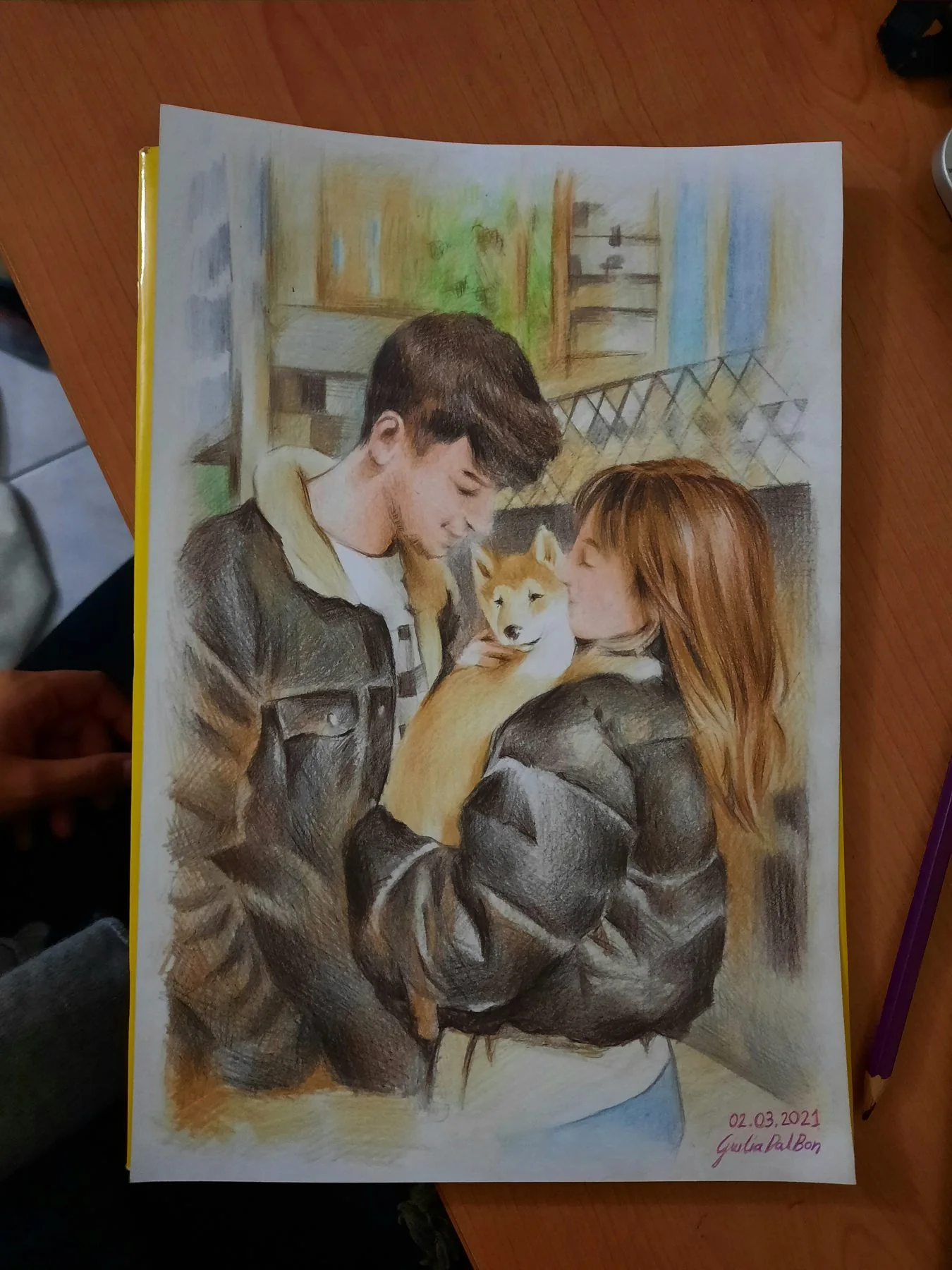 Couple portrait painted on paper, held in the hand